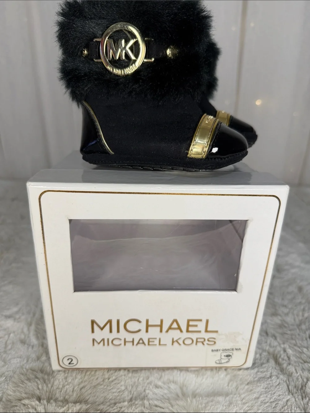 Michael Kors Black Faux Fur Baby Booties with Gold MK Accents